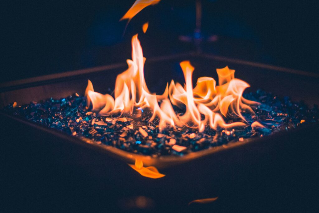 Can I Use Fire Pit Glass In A Wood Fire Pit For Added Aesthetics?